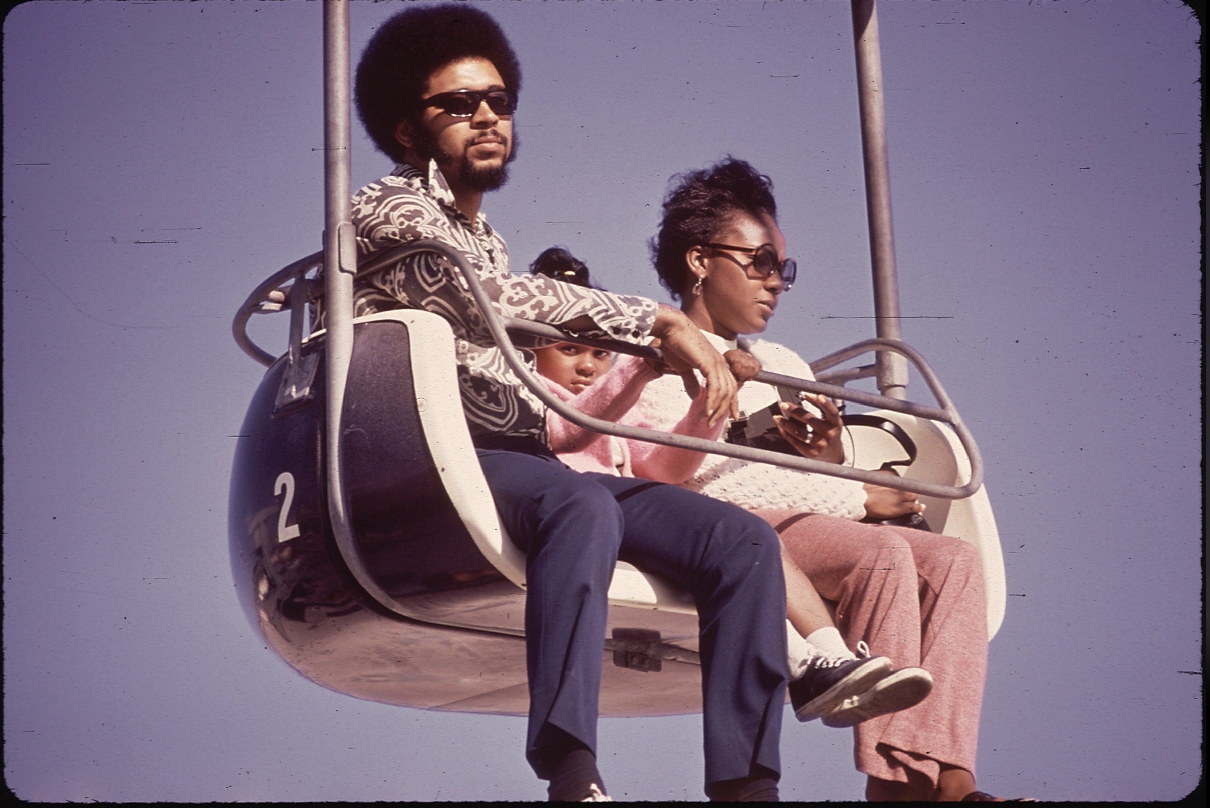 A young family at an amusement park; Santa Cruz, California, 1970. 